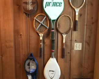 Collection of vintage tennis racquets.