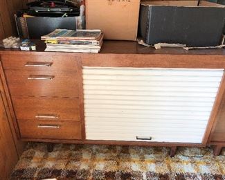 Interesting vintage cabinet with scrolling door.