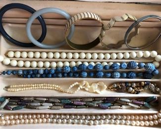 Nice selection of costume jewelry, including necklaces and bracelets.