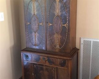 Antique mahogany French Empire china closet/cabinet with flame mahogany and applied embellishments