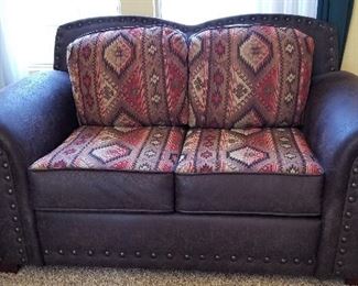 Leather loveseat.  All the cushions are reversible from patterned to all leather.