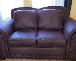 Leather loveseat.  All the cushions are reversible from patterned to all leather.