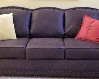 Leather sofa and loveseat.  All the cushions are reversible from patterned to all leather.