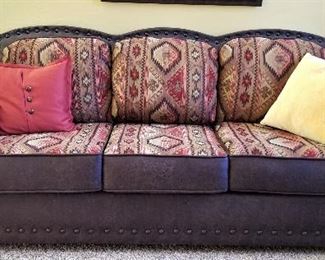 Leather sofa with matching loveseat.  All the cushions are reversible from patterned to all leather.