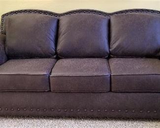 Leather sofa.  All the cushions are reversible from patterned to all leather.