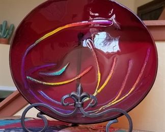 Red decorative dish with stand.