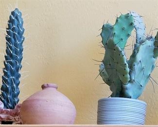 Decorative faux cactus and southwest style pottery.