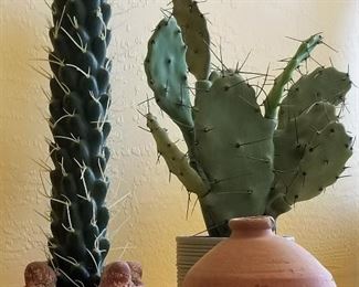 Decorative faux cactus and southwest style pottery.