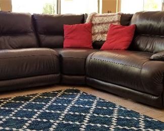 Electric sectional dark brown leather sofa. Both sides electrically recline.