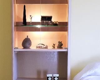 Matching cabinet set one for each side of the bed. Lighted and tray pulls out to use as a nightstand. Light colored whitewashed wood furniture set.