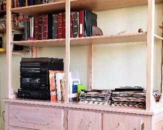 Handcrafted light colored wood bookshelves and storage.