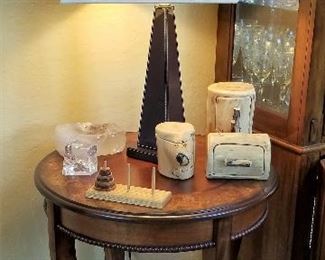 Round side table and modern lamp.