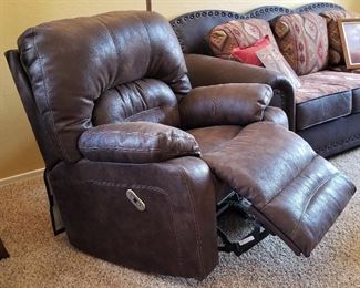Electric dark brown recliner.
