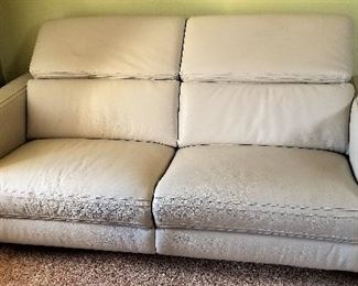 Copenhagen electric leather very light gray sofa with 2 recliners. Purchased recently. Like new. The 2 head rests pop up.