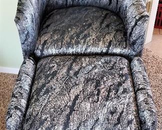 Modern black and gray chair with ottoman.