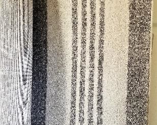 Gray striped large area rug.