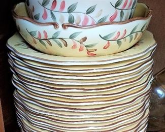 Dinnerware set with cups and all the place settings.