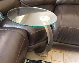 Modern glass and metal C tables on rollers. There are a set of 2.