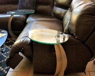 Modern glass and metal C tables on rollers. There are a set of 2.