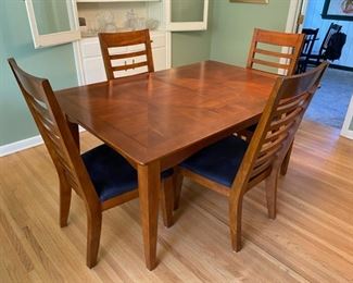 Very nice dining table with four chairs.  Table expands from 62” Long x 42” Wide to 76” Long with one 14” leaf