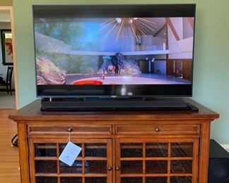 Sony 55” 2160p Smart 4K Ultra HD TV with a Sony 2.1 Channel Soundbar with Wi-Fi & Bluetooth.  Hooker Furniture cherry wood entertainment console