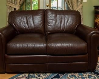 Lot #28 — Leather couch (does not recline) 88” long x 37” wide. Seat is 18" off floor. Matching leather loveseat (does not recline) 64” long x 36”. Seat is 18" off floor