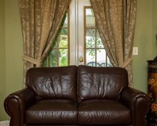 Lot #29 — Leather Mart brand, leather loveseat (does not recline) 64” long x 36”. Seat is 18" off floor. Matching leather couch (does not recline) 88” long x 37” wide. Seat is 18" off floor. 