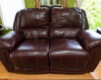 Ashley Furniture. Same power electric reclining loveseat as in Lot #8 - 67" long x 33" deep x 36" tall). 