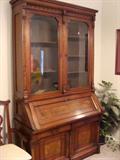 Circa 1870 large drop front secretary bookcase with burl fronts.