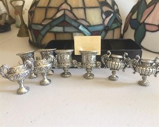 20 Tiffany style lamps and silverplate goblets.