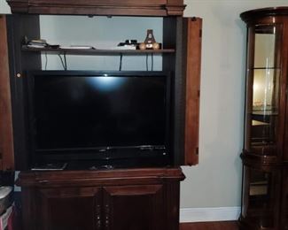 Entertainment Center - holds 42" TV.  54" Wide, 77" Tall, 26" Deep. Boise speakers also for sale!