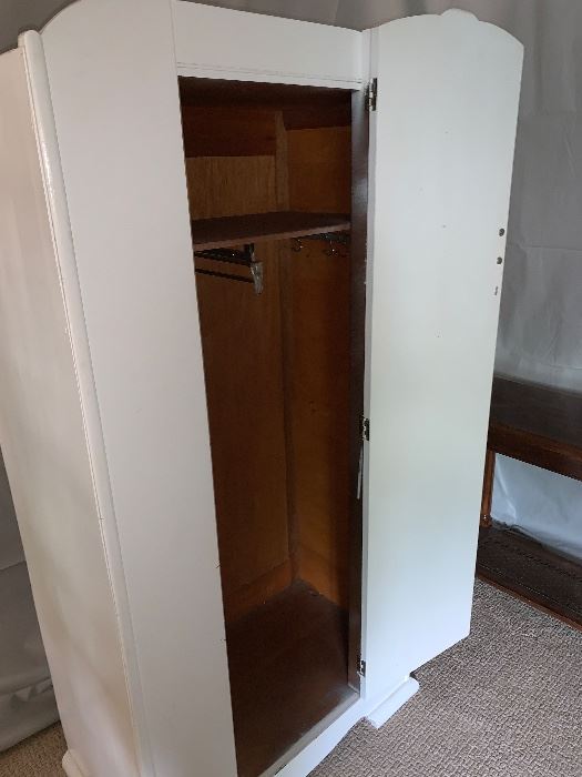 CHARMING BOUTIQUE ARMOIRE. Perfect for brightening up a guest room or for housing little girls' dress-up clothes. Fresh, white with floral details and original hardware. Sturdy condition, solid construction. A wonderful value.
Dimensions
65”H x 31”W x 18”D