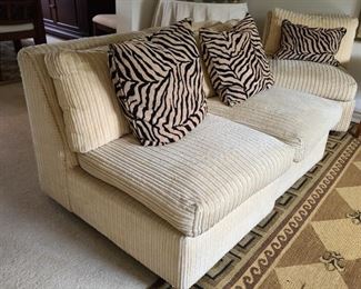 There are several pieces of a sectional in the house.  Each piece measures  34" high x 24" wide. They can be combined in a traditional pattern of an "L" shape sectional, or separated as chairs or couches without arms.