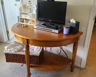 This half-round table in the master bedroom measures 48" wide x 24" deep x 29" high