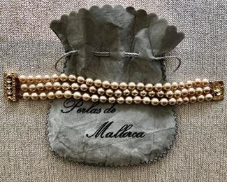 $20 Three strand pearl bracelet in original pouch 
