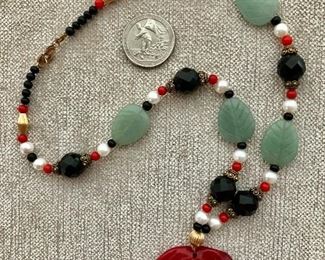 $35 Multi stone necklace, rose medallion, clasp marked "925"