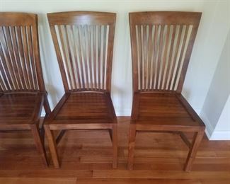 Oyster Cay Collection teak dining chairs.
