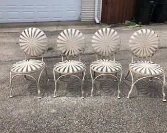 Fabulous iconic Francois Carre sunburst chairs - two chair each have one detached "ray" but are 100% functional as is. The other two are in great condition.  Circa 1930s. 