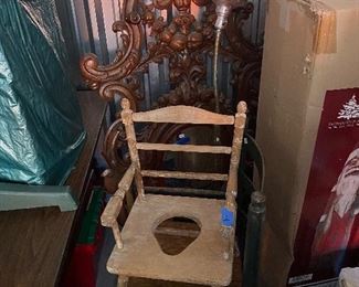 Antique potty chair, antique wicker counter height chair, industrial floor lamp, antique wall hat tree with mirror.