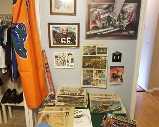 stacks of special edition papers featuring Jaguars and Florida Gators, special magazines, Jaguar tickets and more