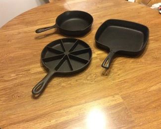 Cast iron. One is Wagner. Very nice condition
