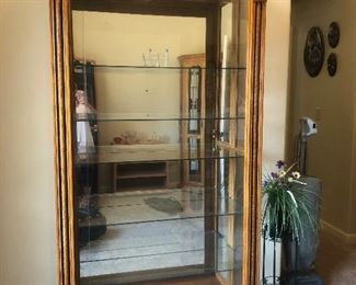 Very nice lighted curio cabinet 