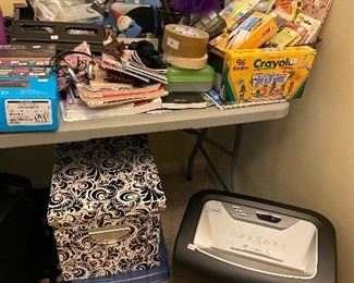 Lots of office supplies, shredder.