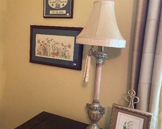 Lamp and framed embroidered items.