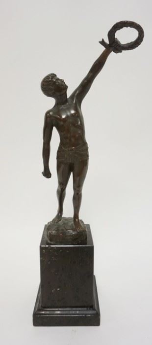 1002 BRONZE STATUE OF A MAN HOLDING A WREATH SIGNED MIAN. ON A BLACK POLISHED STONE BASE. 15 3/8  IN HIGH
