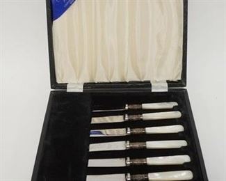 1004 SET OF 6 FISH KNIVES BY WILLIAM ADAMS SHEFFIELD ENGLAND IN ORIGINAL BOX. MOP HANDLES WITH STERLING SILVER COLLARS WITH STAINLESS STEEL BLADES. BLADES AND BOX ARE SIGNED. KNIVES ARE 6 1/2 IN LONG
