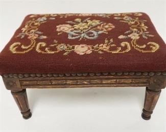 1006 SMALL CARVED STOOL WITH NEEDLEPOINT TOP. 13 1/2 IN X 9 IN, 7 3/4 IN HIGH
