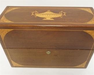 1011	INLAID MAHOGANY TANTALUS BOX. HAS 3 CUTGLASS BOTTLES. ONE BOTTLE HAS  THE STOPPER BROKEN OFF INSIDE THE NECK. 14 3/4 IN X 5 3/4 IN, 10 1/4 IN HIGH
