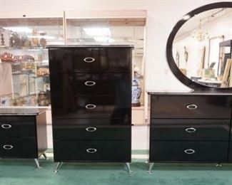 1012	5 PC  BLACK LACQUER AND CHROME MODERN BEDROOM. HIGH CHEST, LOW CHEST WITH MIRROR, 2 NIGHT STANDS AND A HEADBOARD AND FOOT BOARD.HEAD BOARD HAS LEATHER PANELS.BED IS QUEEN SIZE, 60 IN WIDE. LOW DRESSER IS 65 IN WIDE
