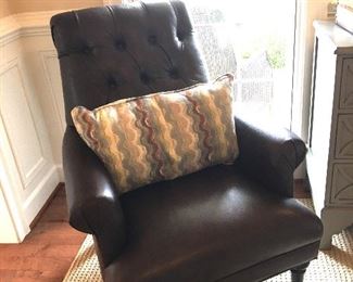  $575 Brown leather armchair 
$38 pillow